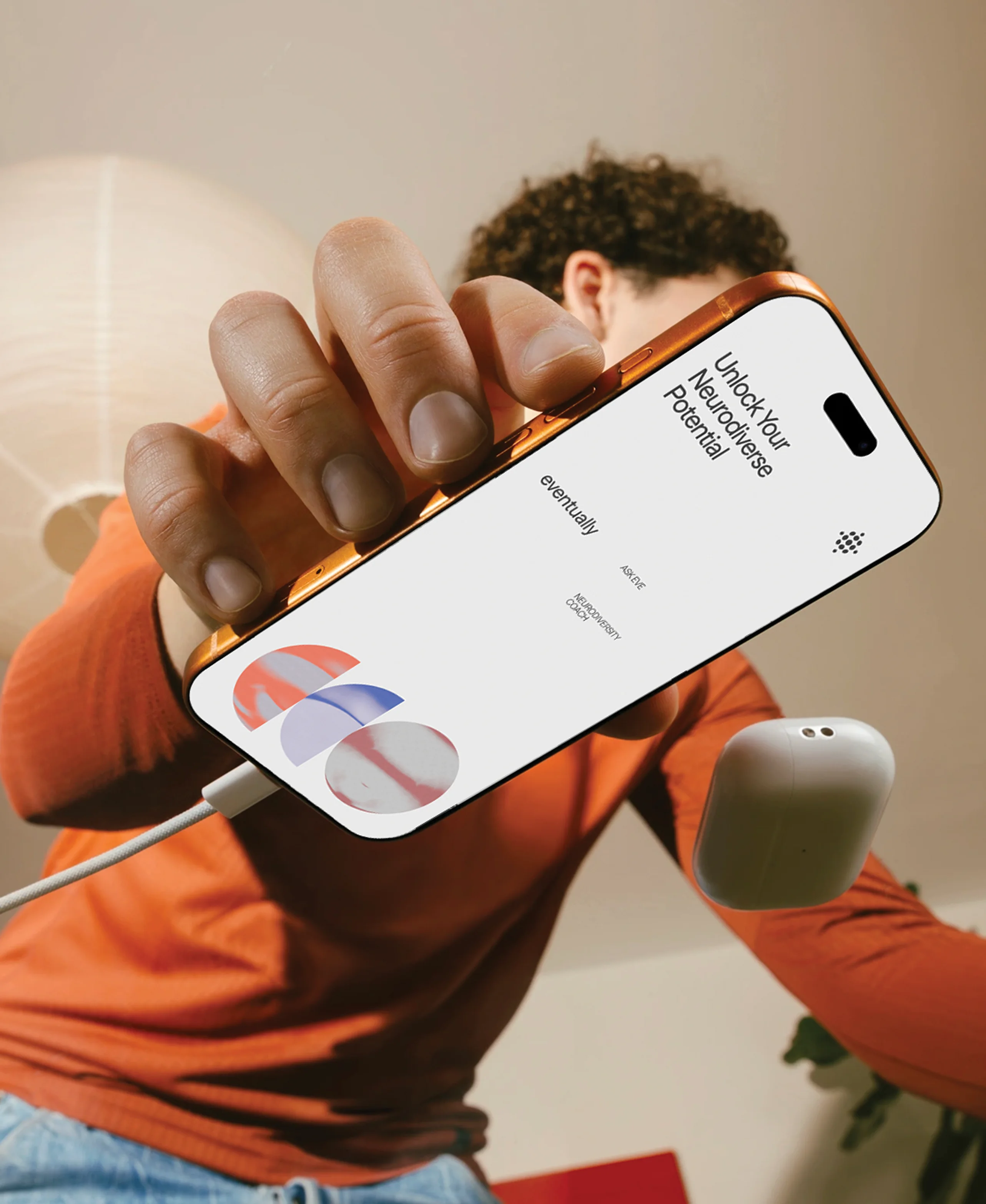 Eventually campaign hero — phone held up showing the app